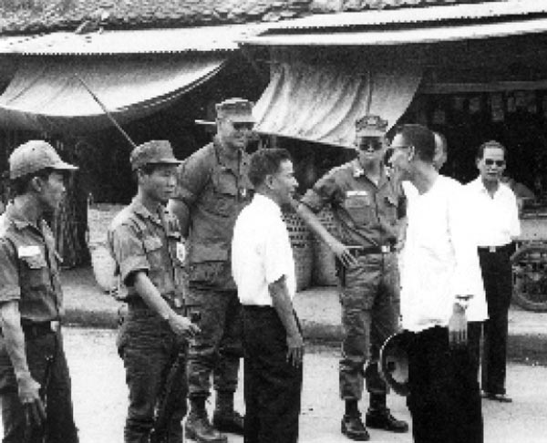 RF/PF adviser and district chief inspect troops in Gia Dinh Province, 1969.